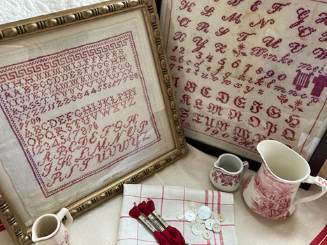 A Collection of Antique Red Samplers